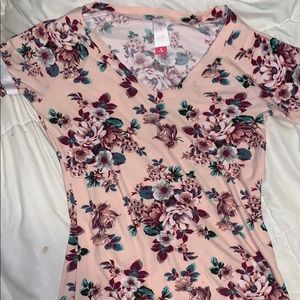 A light pink flowery shirt